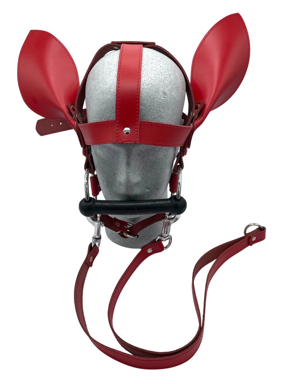 Rotes Kopfgeschirr aus stabilem Rindsleder mit integriertem Ballknebel, Metallringen und seitlichen Lederohren, individuell einstellbar für festen Sitz.